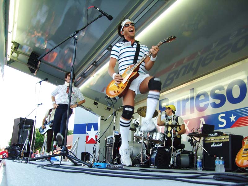 Photo of band members performing